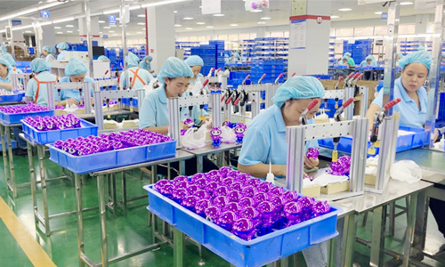 Workers and machines assemble toys at Soldaytoys factory, ensuring quality wholesale toy production for global brands.