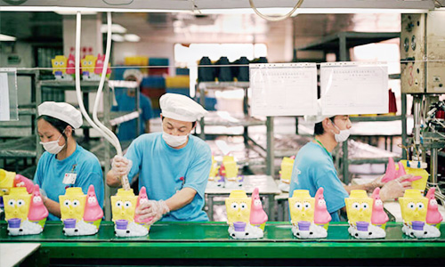 China toy manufacture at Soldaytoys: workers and machines producing quality wholesale toys for global markets.